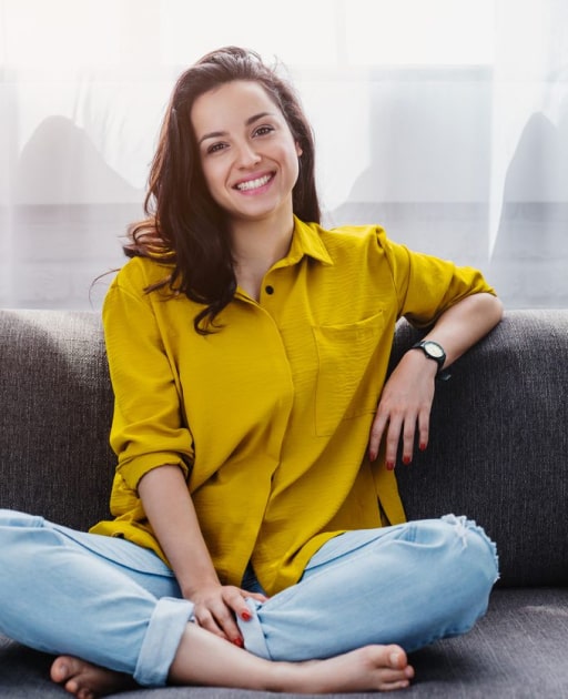 Smiling woman showing her bright, natural teeth after visiting Cottonwood Dental, trusted cosmetic dentist in Salt Lake City