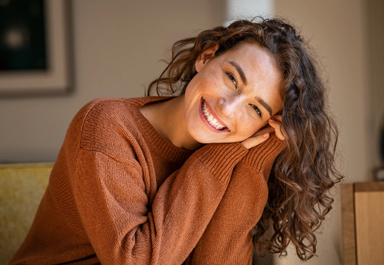 Happy woman showing her confident smile after cosmetic dental care in Salt Lake City