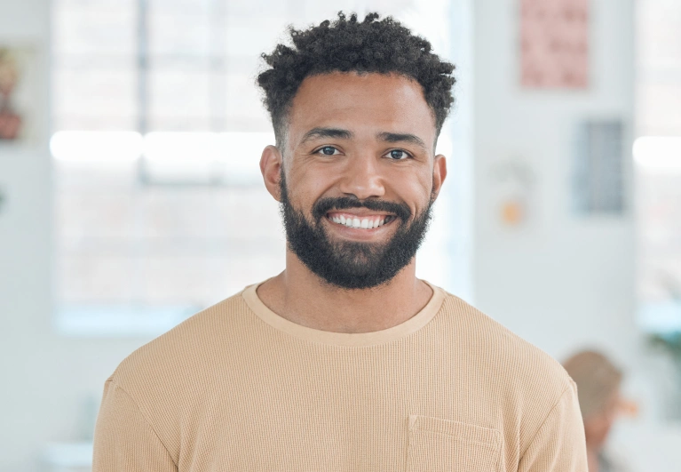 Smiling man showing comfort and confidence after a gentle root canal treatment at Cottonwood Dental in Salt Lake City.