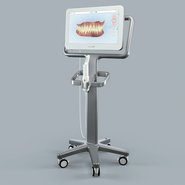 Digital dental scanner on mobile stand displaying 3D teeth model for intraoral scanning procedures.